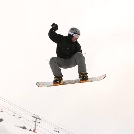 John Patterson enjoying snowboarding on holiday